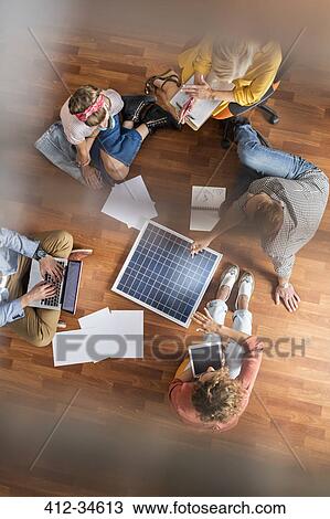 Overhead view designers brainstorming on floor in meeting View Large Photo Image Stock Image - Overhead view designers brainstorming on floor in meeting. Fotosearch