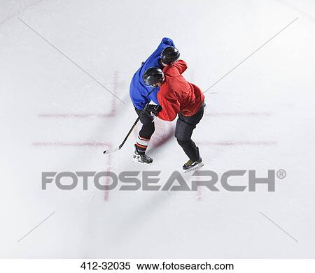 Stock Photography - Overhead view hockey opponents colliding. Fotosearch
