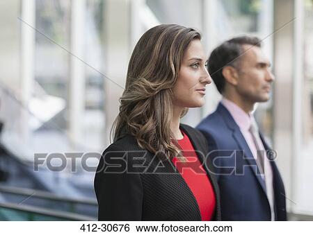 Stock Photograph - Pensive corporate businesswoman looking away. Fotosearch