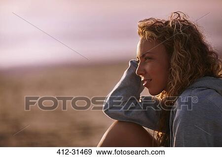 Pensive woman looking away on beach View Large Photo Image Stock Photo - Pensive woman looking away on beach. Fotosearch