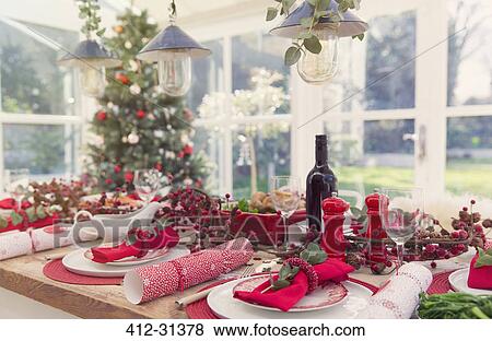 Placesettings and decorations on Christmas table View Large Photo Image Stock Photo - Placesettings and decorations on Christmas table. Fotosearch