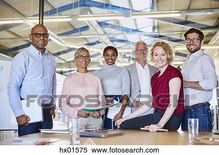 Portrait confident business people in conference room View Large Photo Image Stock Photography - Portrait confident business people in conference room. Fotosearch