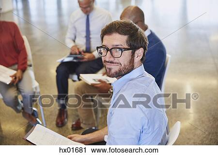 Stock Image - Portrait confident businessman in meeting. Fotosearch