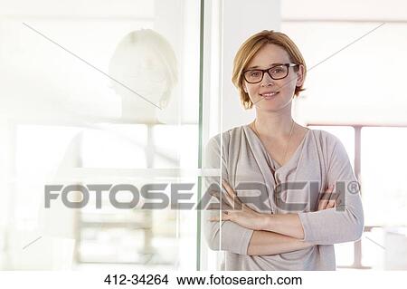 Picture - Portrait confident businesswoman in office. Fotosearch