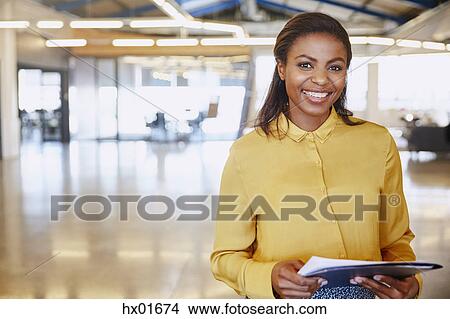 Picture - Portrait confident businesswoman in office. Fotosearch