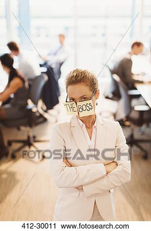 Portrait confident businesswoman wearing The Boss eyeglasses in office View Large Photo Image Stock Image - Portrait confident businesswoman wearing The Boss eyeglasses in office. Fotosearch