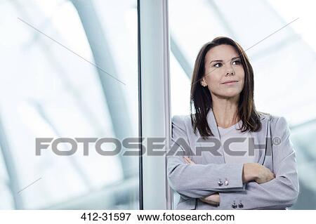 Stock Photo - Portrait confident businesswoman looking away. Fotosearch
