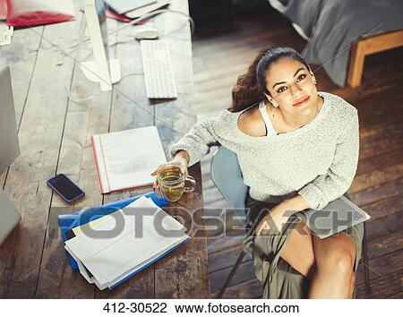 Portrait confident college student studying with tea and digital tablet View Large Photo Image Stock Image - Portrait confident college student studying with tea and digital tablet. Fotosearch