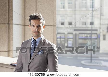Stock Photograph - Portrait confident corporate businessman. Fotosearch