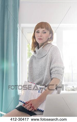 Portrait confident creative businesswoman holding notebook in office View Large Photo Image Stock Photo - Portrait confident creative businesswoman holding notebook in office. Fotosearch