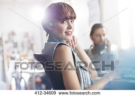 Portrait confident female design professional in office View Large Photo Image Stock Photo - Portrait confident female design professional in office. Fotosearch