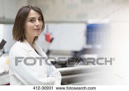 Stock Image - Portrait confident female engineer in steel factory. Fotosearch