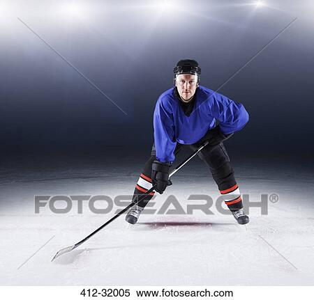 Portrait confident hockey player on ice View Large Photo Image Stock Photography - Portrait confident hockey player on ice. Fotosearch