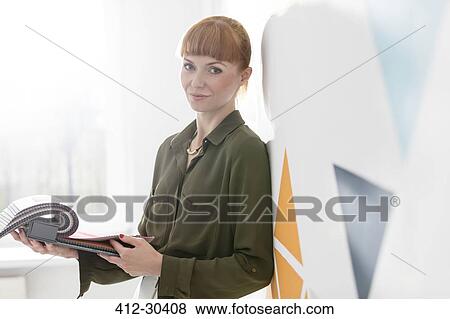 Portrait confident interior designer looking at fabric swatches View Large Photo Image Stock Photo - Portrait confident interior designer looking at fabric swatches. Fotosearch