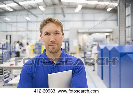 Portrait confident manager with digital tablet in steel factory View Large Photo Image Stock Image - Portrait confident manager with digital tablet in steel factory. Fotosearch