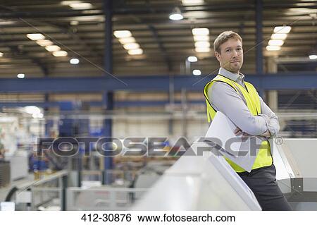 Stock Photograph - Portrait confident supervisor in steel factory. Fotosearch