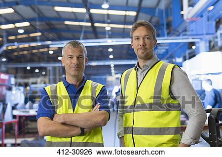 Portrait confident supervisors in steel factory View Large Photo Image Stock Photograph - Portrait confident supervisors in steel factory. Fotosearch