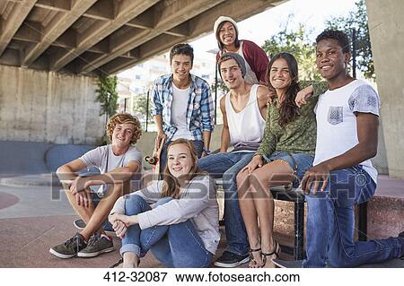 Portrait confident teenage friends hanging out at skate park View Large Photo Image Stock Photo - Portrait confident teenage friends hanging out at skate park. Fotosearch