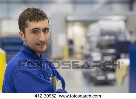 Portrait confident worker in steel factory View Large Photo Image Stock Image - Portrait confident worker in steel factory. Fotosearch