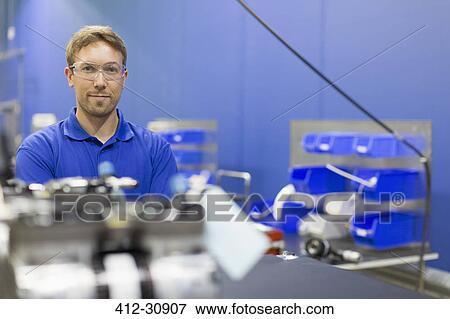 Portrait confident worker in steel factory View Large Photo Image Stock Photo - Portrait confident worker in steel factory. Fotosearch