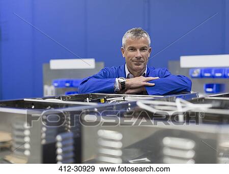 Portrait confident worker in steel factory View Large Photo Image Stock Photo - Portrait confident worker in steel factory. Fotosearch