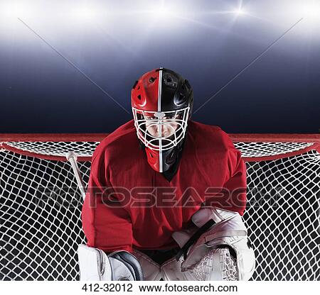 Portrait determined hockey goalie protecting goal net View Large Photo Image Stock Image - Portrait determined hockey goalie protecting goal net. Fotosearch