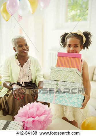 Portrait girl carrying stack of birthday gifts View Large Photo Image Stock Photo - Portrait girl carrying stack of birthday gifts. Fotosearch
