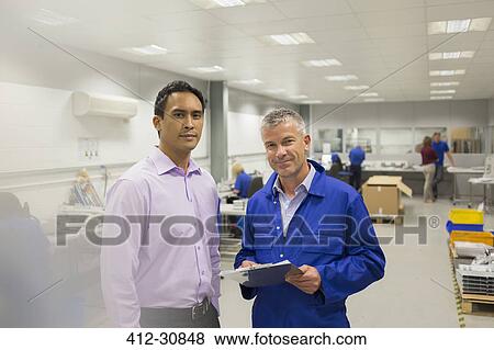 Stock Photo - Portrait manager and supervisor in steel factory. Fotosearch