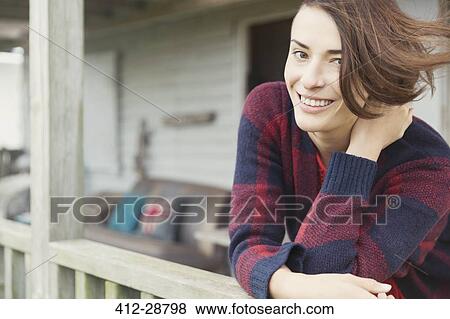 Portrait smiling brunette woman on porch View Large Photo Image Stock Photo - Portrait smiling brunette woman on porch. Fotosearch
