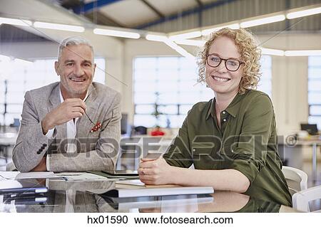 Portrait smiling business people in meeting View Large Photo Image Stock Image - Portrait smiling business people in meeting. Fotosearch