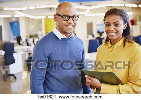 Portrait smiling business people in office View Large Photo Image Stock Image - Portrait smiling business people in office. Fotosearch