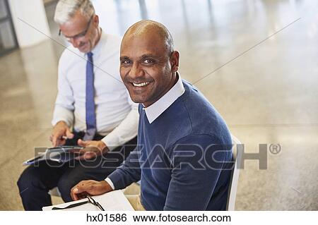 Portrait smiling businessman in meeting View Large Photo Image Stock Photograph - Portrait smiling businessman in meeting. Fotosearch