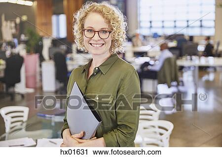 Portrait smiling businesswoman in office View Large Photo Image Stock Image - Portrait smiling businesswoman in office. Fotosearch