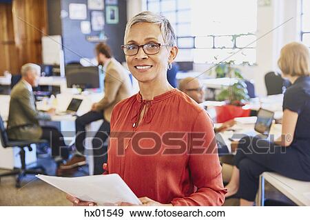 Stock Photo - Portrait smiling businesswoman in office. Fotosearch