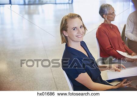 Portrait smiling businesswoman in meeting View Large Photo Image Stock Photograph - Portrait smiling businesswoman in meeting. Fotosearch