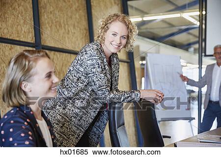 Portrait smiling businesswoman in conference room meeting View Large Photo Image Stock Photography - Portrait smiling businesswoman in conference room meeting. Fotosearch