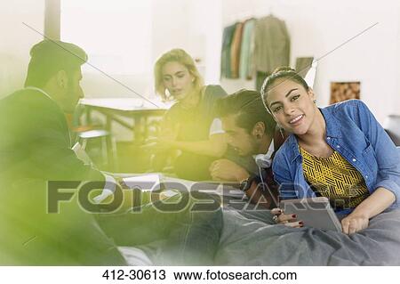 Portrait smiling college student studying with friends on bed View Large Photo Image Stock Image - Portrait smiling college student studying with friends on bed. Fotosearch