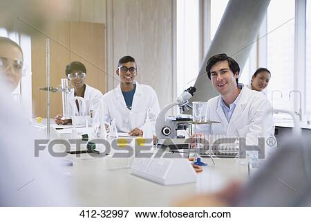 Portrait smiling college students in science laboratory classroom View Large Photo Image Stock Photo - Portrait smiling college students in science laboratory classroom. Fotosearch