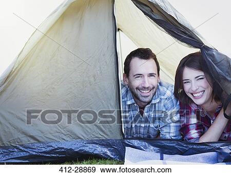 Stock Photo - Portrait smiling couple in tent. Fotosearch