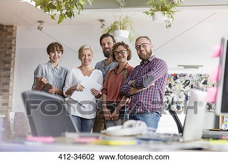 Stock Image - Portrait smiling design professional team in office. Fotosearch