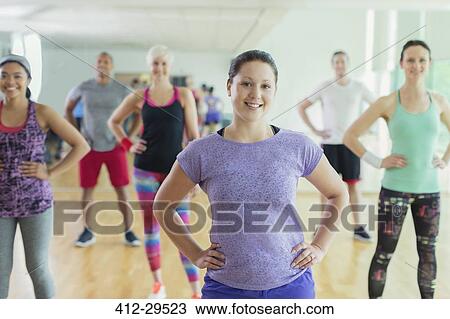 Portrait smiling exercise class with hands on hips in studio View Large Photo Image Stock Image - Portrait smiling exercise class with hands on hips in studio. Fotosearch