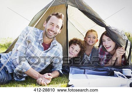 Portrait smiling family in tent View Large Photo Image Stock Image - Portrait smiling family in tent. Fotosearch