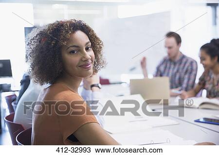 Portrait smiling female college student studying View Large Photo Image Stock Image - Portrait smiling female college student studying. Fotosearch