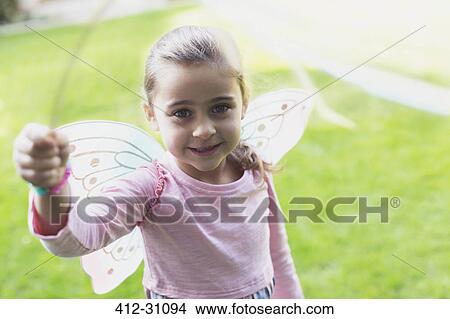 Picture - Portrait smiling girl in fairy wings. Fotosearch