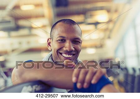 Portrait smiling man at gym View Large Photo Image Stock Photo - Portrait smiling man at gym. Fotosearch