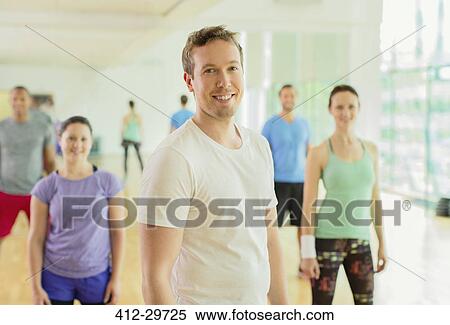 Stock Photography - Portrait smiling man in exercise class. Fotosearch