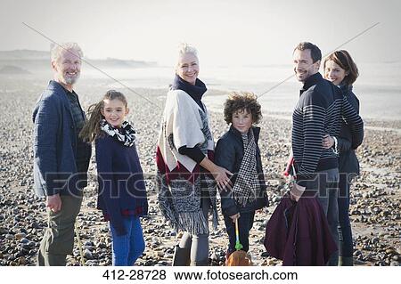 Portrait smiling multi-generation family on sunny beach View Large Photo Image Stock Photo - Portrait smiling multi-generation family on sunny beach. Fotosearch