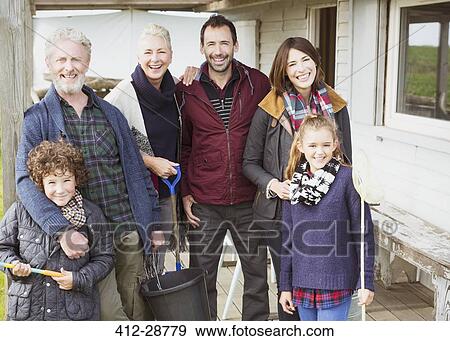 Stock Photo - Portrait smiling multi-generation family on porch. Fotosearch