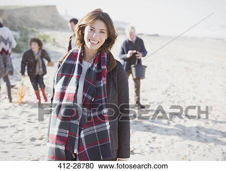 Portrait smiling woman in plaid scarf with family on beach View Large Photo Image Stock Image - Portrait smiling woman in plaid scarf with family on beach. Fotosearch