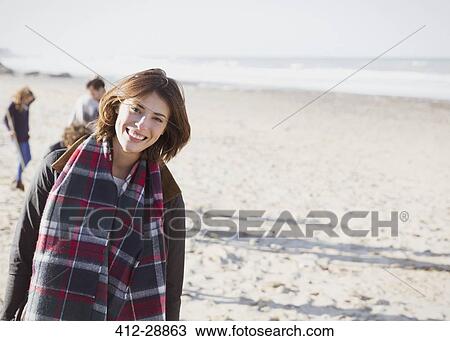 Portrait smiling woman in plaid scarf on sunny beach View Large Photo Image Stock Image - Portrait smiling woman in plaid scarf on sunny beach. Fotosearch